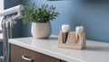 Dental model showing an implant placed in the jawbone beside a natural tooth in an oral surgery office.
