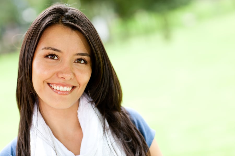 Portrait of a happy woman smiling outdoors