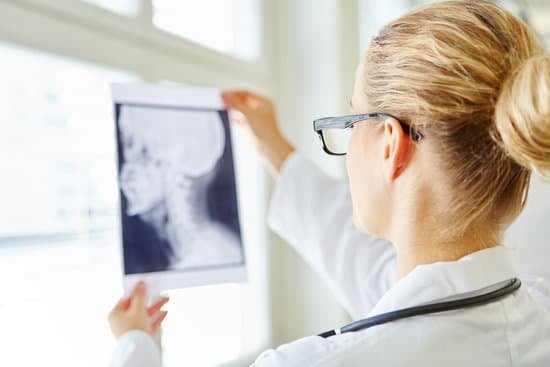 Oral surgeon looking at an x-ray