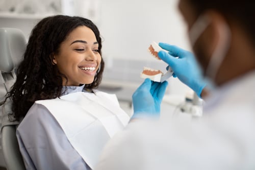 Woman sitting with doctor